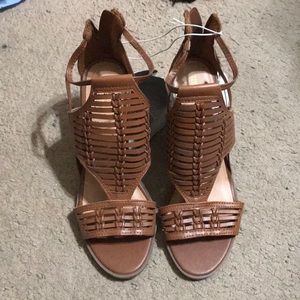 Brand new sandals with heel.